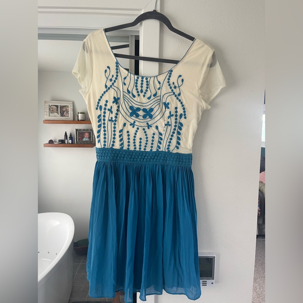 Francesca blue and white embroidered dress with pleats.